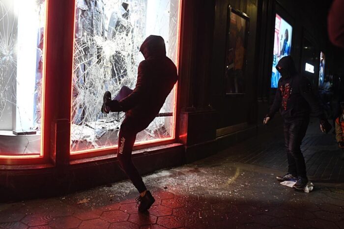 Violence and looting mar protests over jailed rapper